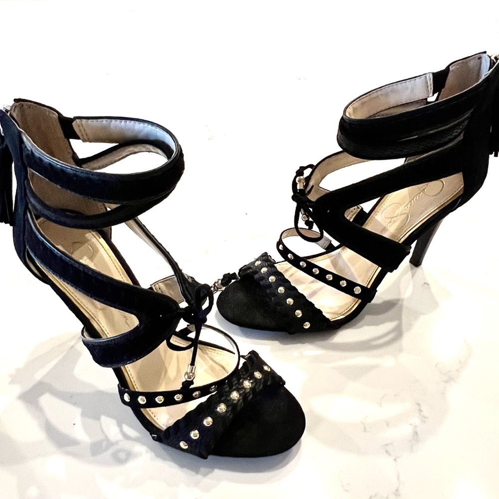 Strappy black dress sandal w/ gold studs and fringe ties by Jessica Simpson.